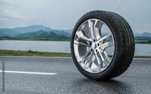 Car alloy wheels placed on a beautiful natural road.