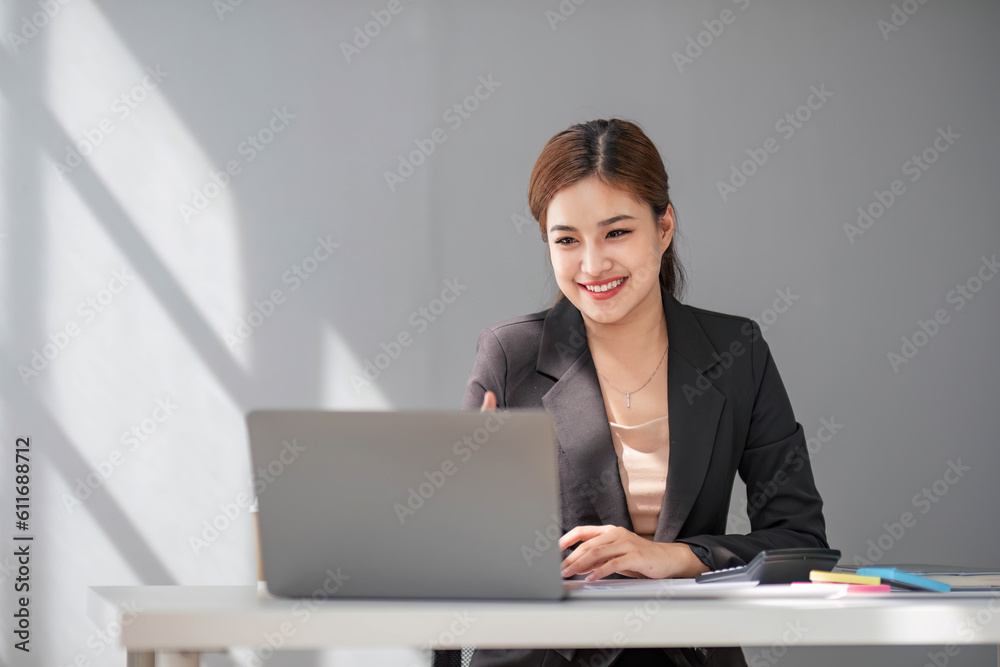 Business woman using calculator for do math finance on wooden desk in office and business working background, tax, accounting, statistics and analytic research concept. Business woman using calculator for do math finance on wooden desk in office and business working background, tax, accounting, statistics and analytic research concept.