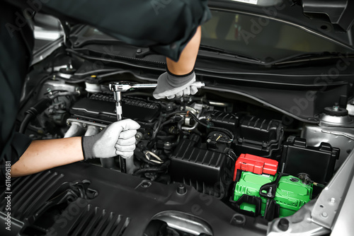 Wallpaper Mural Car care maintenance and servicing, Hand technician auto mechanic using the wrench to fix car or repairing change spare part engine problem and insurance service support the range of car check. Torontodigital.ca