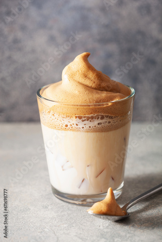 Obraz na płótnie dalgona coffee in glass. trendy Instant coffee whipped with sugar and hot water w salonie
