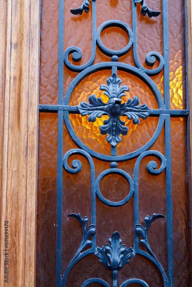 old wooden door with wrought iron fence old wooden door with wrought iron fence