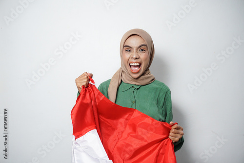 Portrait of Young Asian Muslim Women celebrate Indonesian independence day isolated on white background