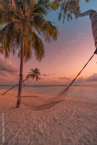 Fototapeta Naklejka Na Ścianę i Meble -  Romantic beautiful tropical Maldives beach landscape. Colorful dreamy sea sky swing or hammock on coconut palm trees. Luxury vacation, destination honeymoon concept. Exotic travel, relax peace seaside