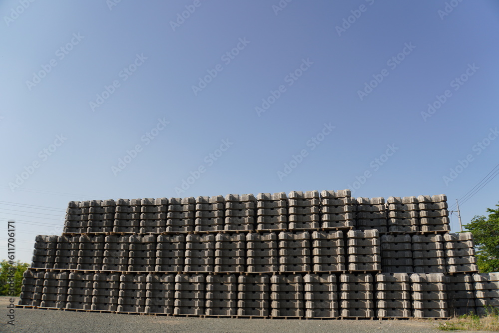 a collection of cement blocks or bricks lined up outdoors a collection of cement blocks or bricks lined up outdoors