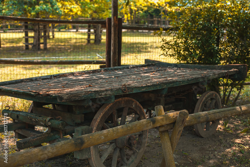 Wooden wheel of an old cart. Old wagon. Farm in Italy. rural life. Voghera, Lombardy.  photo