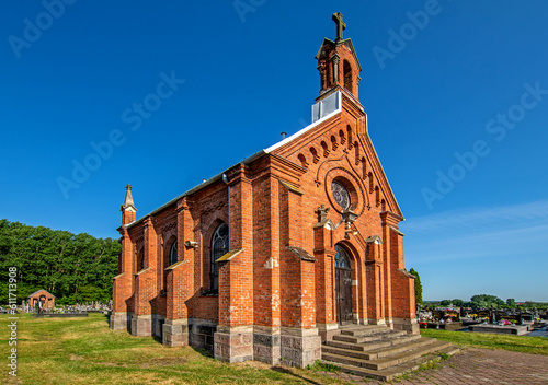 General view and close-up of architectural details of a cemetery chapel built in the second half of the 19th century in Czerwin, Mazovia, Poland.