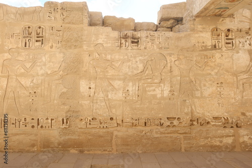 Inscriptions on the walls of the mortuary temple of Medinet Habu in Luxor in Egypt photo