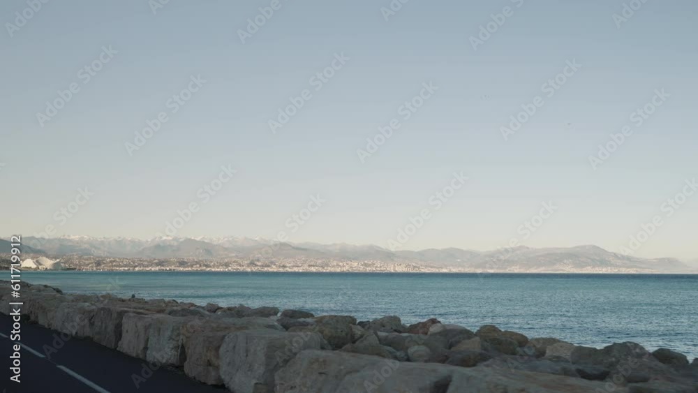 Slow motion side view driving plate of Antibes beach Slow motion side view driving plate of Antibes beach