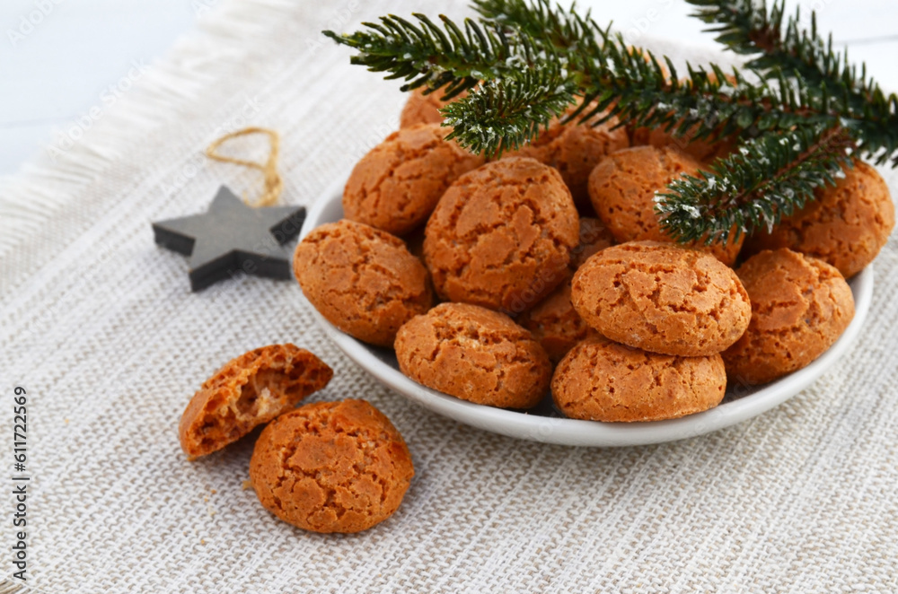 Traditional Italian almond cookies amaretti on a white background with copy space.Famous amarettini cookie biscuits.Delicious Christmas pastry popular in Italy.Selective focus. Traditional Italian almond cookies amaretti on a white background with copy space.Famous amarettini cookie biscuits.Delicious Christmas pastry popular in Italy.Selective focus.