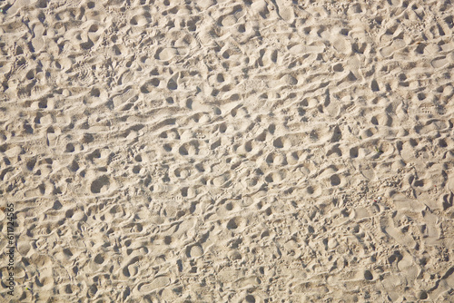 Background yellow sand with human footprints