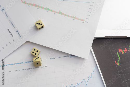 Dices cubes to trader. Cubes with the words SELL BUY on financial chart and columns of quotations as background. Selective focus