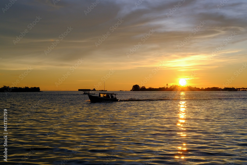 sunset view from the pier in makassar city, sunset at the sea, sunset over the sea, sunset in the sea