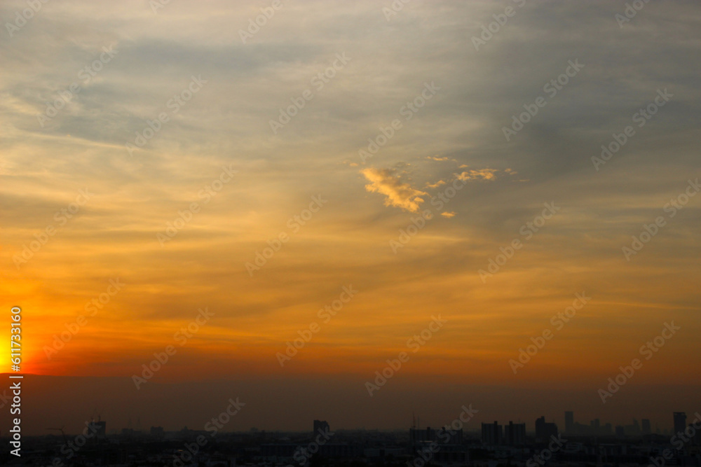 orange blue sky background with cloud and town building in evening of the day sunset