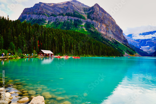 The Iconic, world famous, picture perfect Lake Louise is framed in the early morning sun near Banff in the Canada rockies © InnerPeace