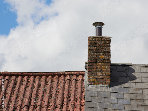 Vintage chimney on roof of old farm