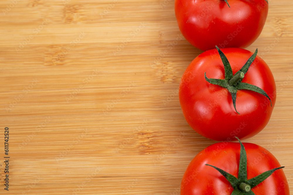 tomatoes back ground healthy food over a wood plate tomatoes back ground healthy food over a wood plate