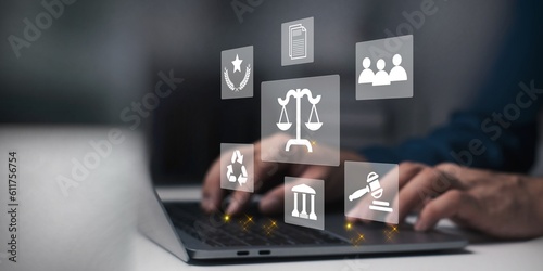 Legal business concept. Labor law, Lawyer, Online legal advice, Hand of human with legal services icon on laptop screen.