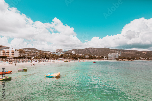 hotels, white beach and turquoise sea in palmanova beach, mallorca, spain, balearic islands