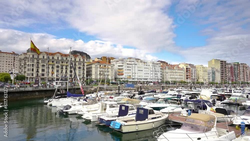 Santander, SPAIN - August 21 2022: Beautiful port of Santander. Boats docked. Travel destination in North of Spain. Panoramic view of marina and part of the city center. Stabilized static video photo
