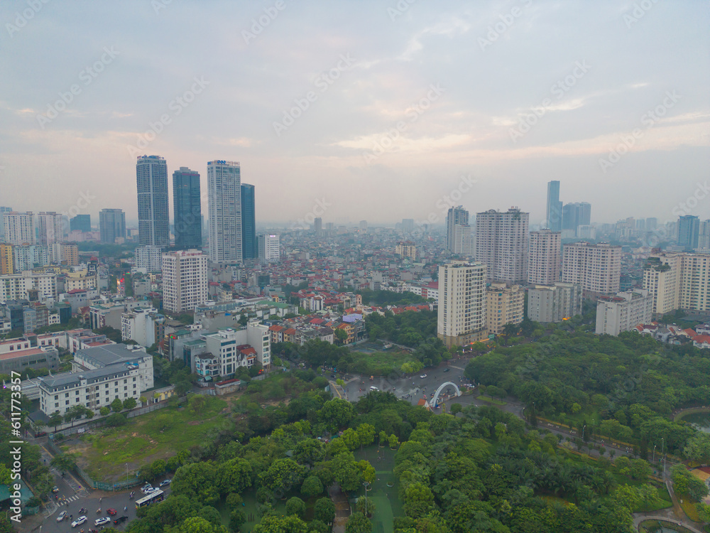 Fototapeta premium Aerial view of Hanoi Downtown Skyline with green garden park, Vietnam. Financial district and business centers in smart urban city in Asia. Skyscraper and high-rise buildings.