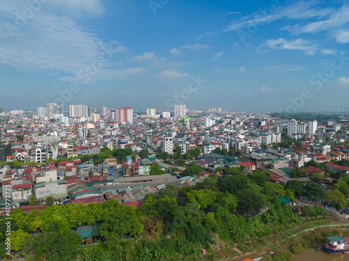 Aerial view of Hanoi Downtown Skyline with green garden park, Vietnam. Financial district and business centers in smart urban city in Asia. Skyscraper and high-rise buildings.