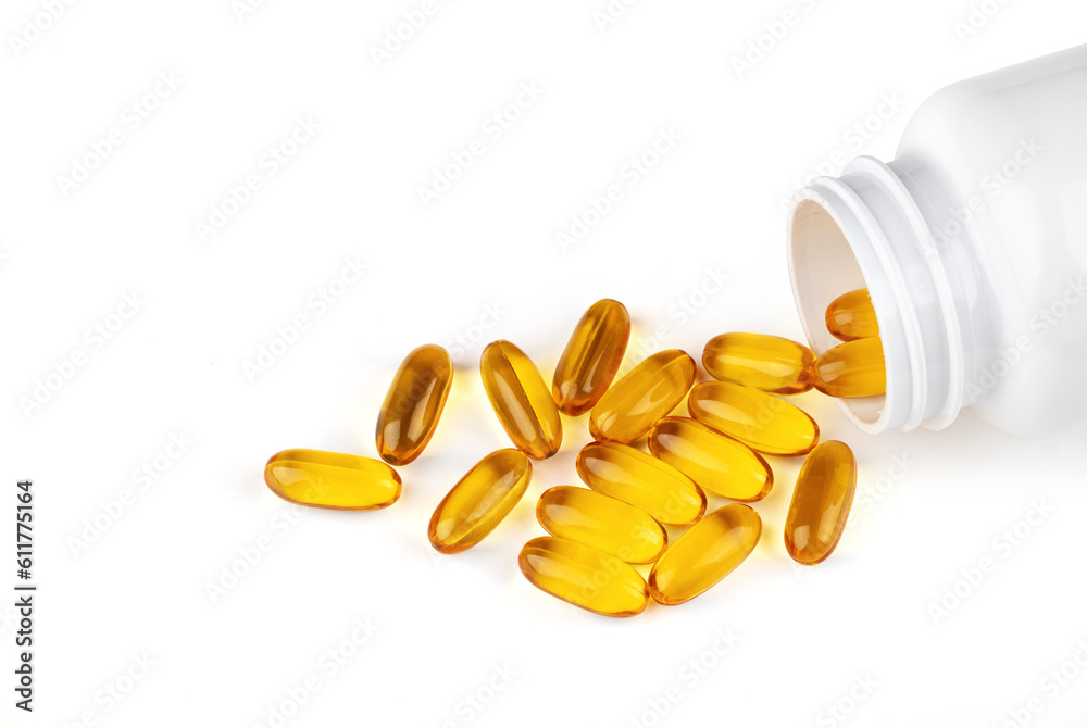 Cod liver oil omega 3 gel capsules spilling out of bottle isolated on white background Cod liver oil omega 3 gel capsules spilling out of bottle isolated on white background