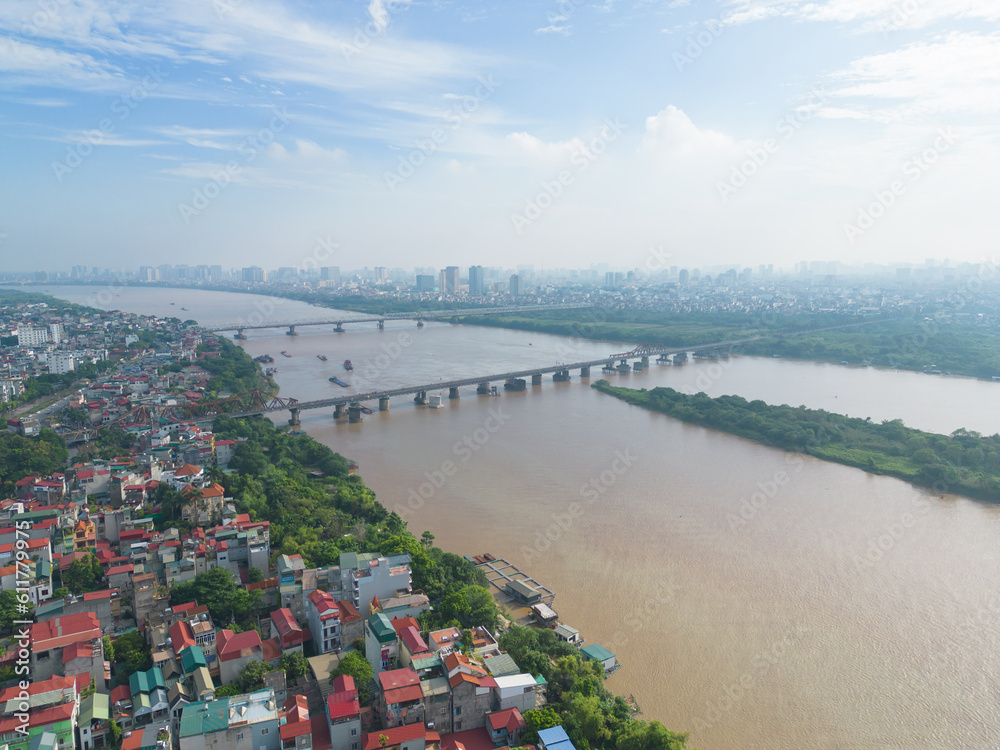 Aerial view of Long Bien railway bridge through the river crossing the Red River in Hanoi City, Vietnam. Tourist attraction landmark.