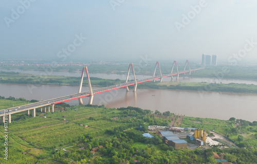 Aerial view of Cau Nhat Tan Cable Bridge or Vietnam–Japan Friendship Bridge crossing the Red River in Hanoi City, Vietnam. Tourist attraction landmark.