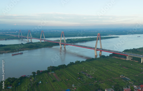 Aerial view of Cau Nhat Tan Cable Bridge or Vietnam–Japan Friendship Bridge crossing the Red River in Hanoi City, Vietnam. Tourist attraction landmark.