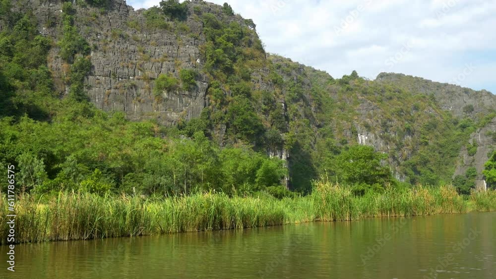 Rice paddies and amazing rock formations along the Sao Khe River near the town of Ninh Binh, Vietnam. Rice paddies and amazing rock formations along the Sao Khe River near the town of Ninh Binh, Vietnam.