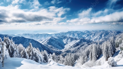 Serene mountain range covered in snow, with a breathtaking view of the valley below © Damian Sobczyk
