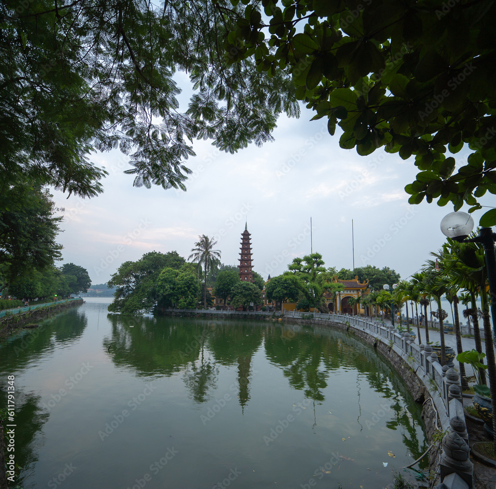 Tran Quoc temple pagoda. Tourist attraction landmark in urban city town of Hanoi, Vietnam.