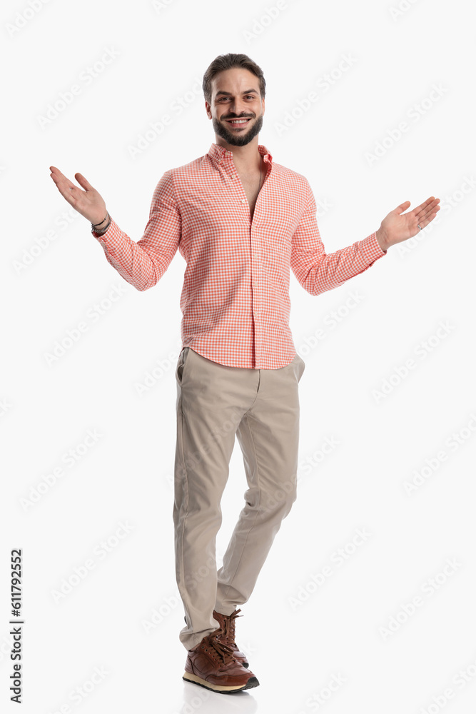 excited young guy in plaid shirt opening arms and welcoming excited young guy in plaid shirt opening arms and welcoming