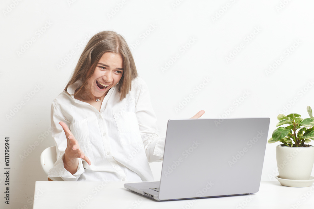 happy girl with laptop rejoices on white background happy girl with laptop rejoices on white background