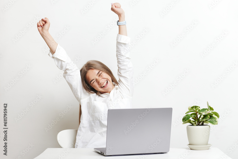 happy girl with laptop rejoices on white background happy girl with laptop rejoices on white background