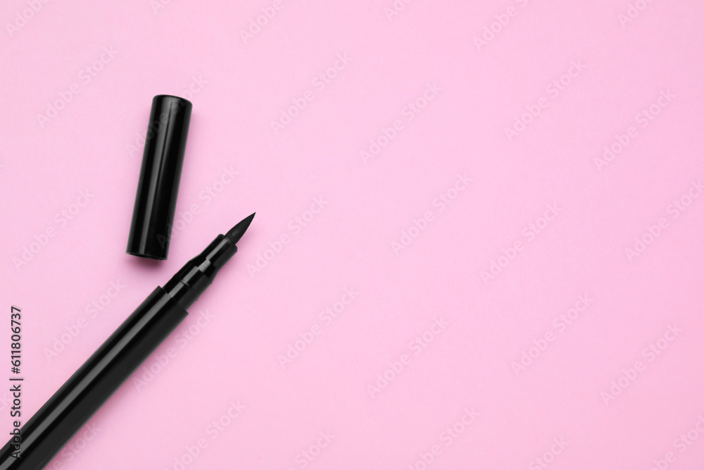 Eyeliner marker on pink background, top view with space for text. Makeup product Eyeliner marker on pink background, top view with space for text. Makeup product