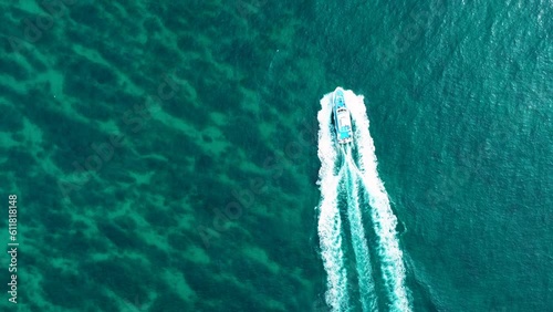 Aerial view of small fishing boat in the sea