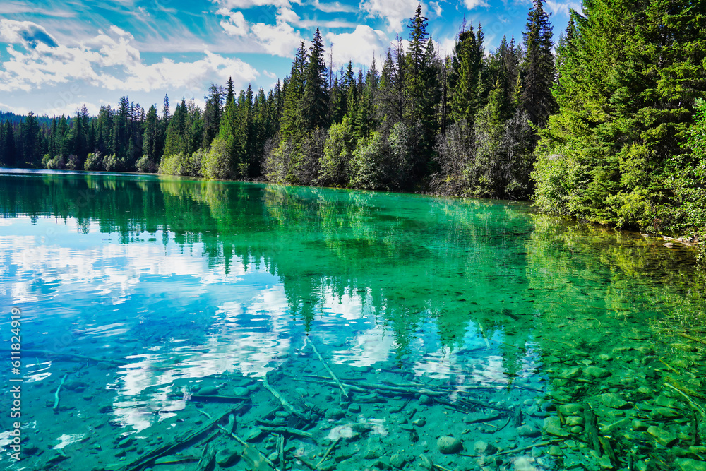Emerald green shades of the lake waters in the Valley of Five Lakes region trek near Jasper in the Canada Rockies