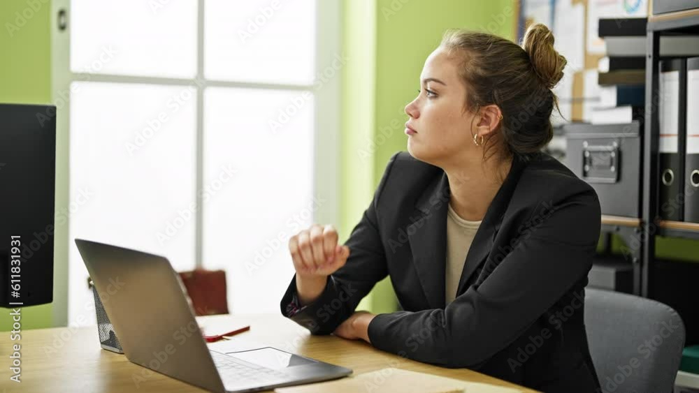 Young beautiful hispanic woman business worker using laptop thinking at office Young beautiful hispanic woman business worker using laptop thinking at office