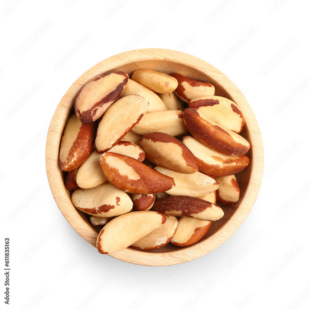 Fototapeta premium Wooden bowl of tasty Brazil nuts on white background
