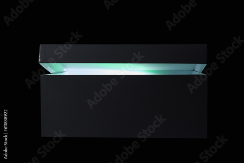 Camera flash in box on blac...