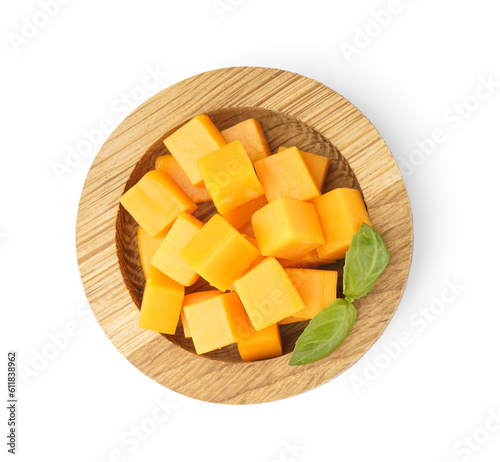 Wooden bowl with cubes of tasty cheddar cheese on white background