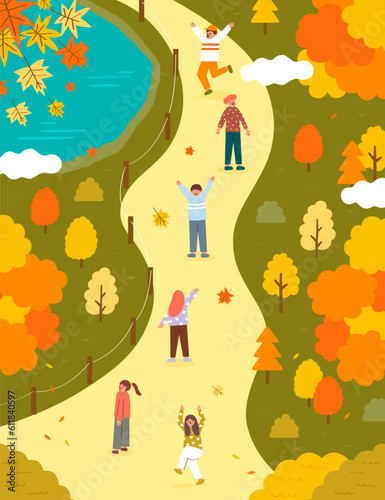 People walking on the autumn path in the park, surrounded by colorful trees and falling leaves