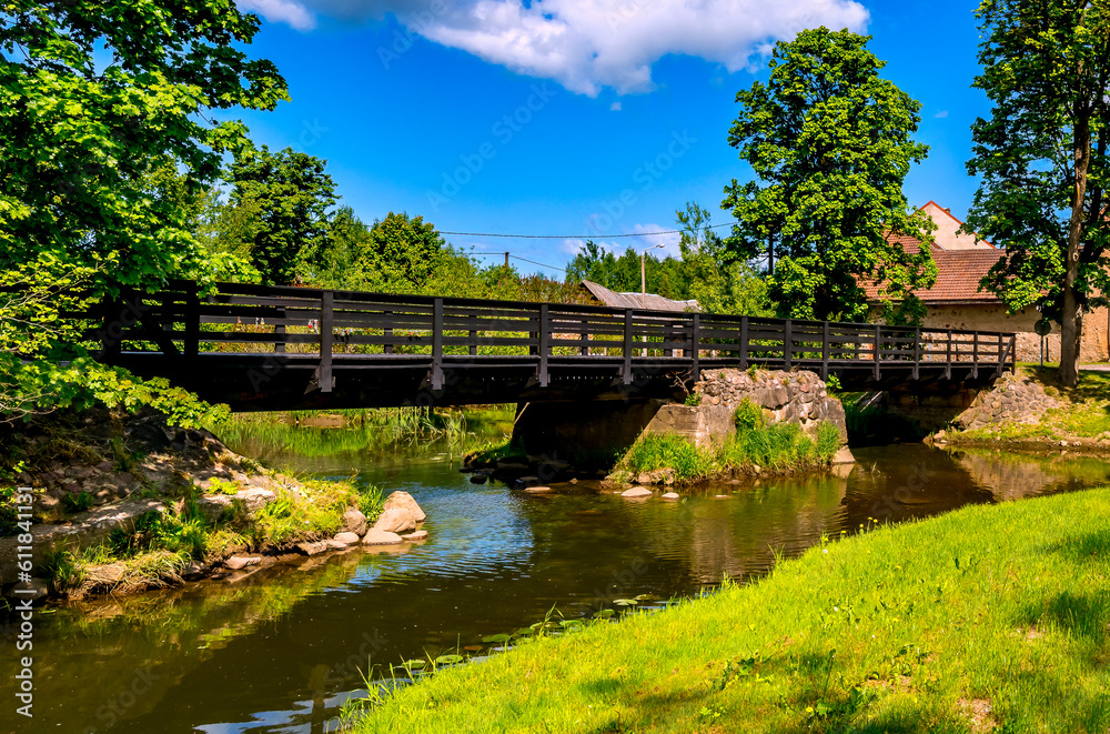 Old bridge over the river in countryside