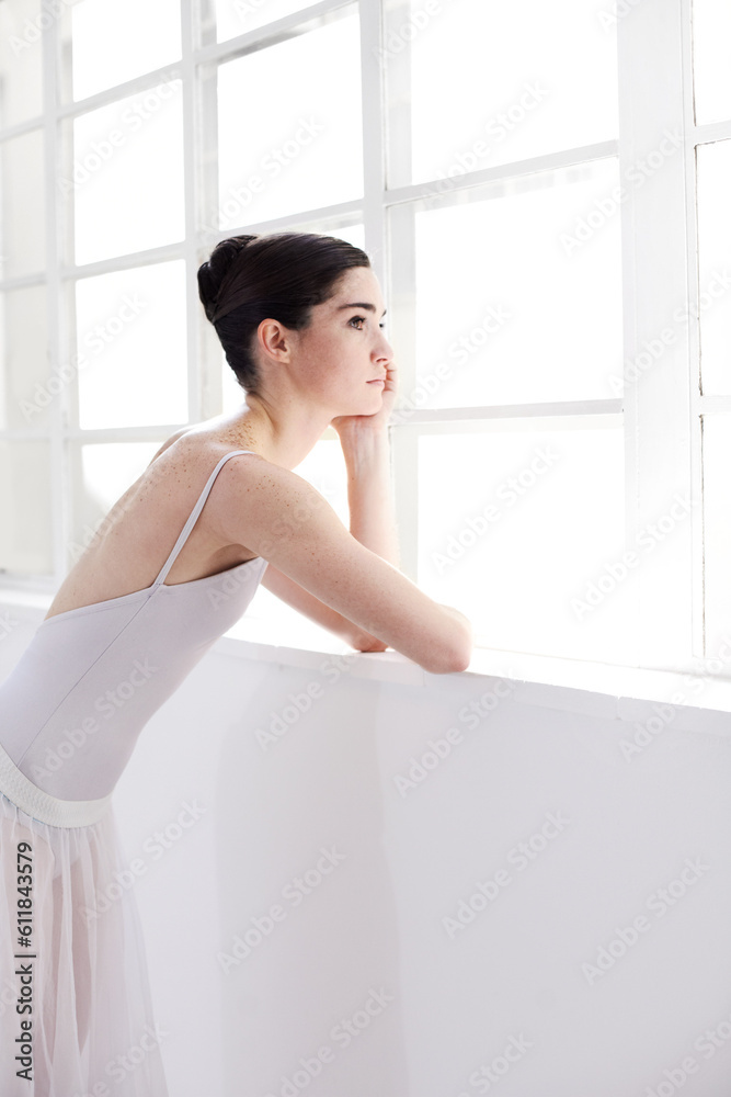 Woman, ballerina and thinking by window in ballet for dance, vision or doubt in the art studio. Female person or dancer looking out glass in decision, think or dream with dancing costume indoors Woman, ballerina and thinking by window in ballet for dance, vision or doubt in the art studio. Female person or dancer looking out glass in decision, think or dream with dancing costume indoors