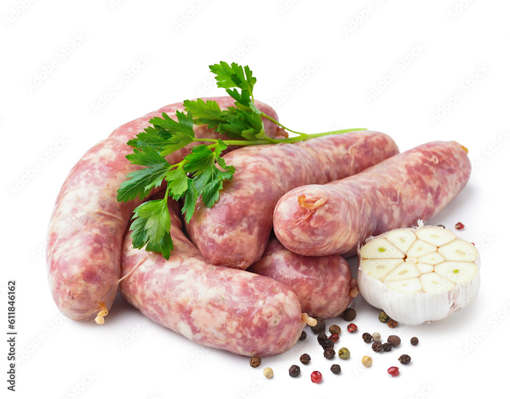 Raw fresh sausages, parsley, garlic and peppercorn on white background