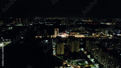 Wallpaper Mural aerial drone shot at night over gurgaon showing cityscape with lights from skyscrapers and homes showing the cityscape Torontodigital.ca