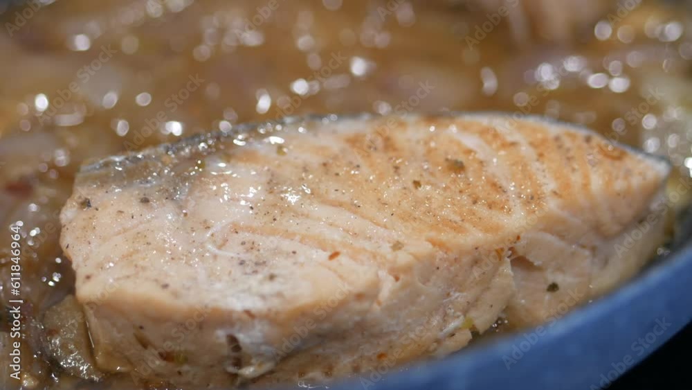 closeup of frying a fish in a cooking pan , closeup of frying a fish in a cooking pan ,