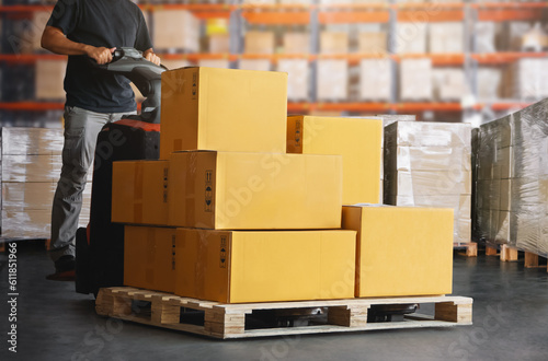 Workers Unloading Package Boxes on Pallets in Warehouse. Electric Forklift Pallet Jack Loader. Shipping Supplies. Supply Chain Shipment Goods. Distribution Warehouse Logistics