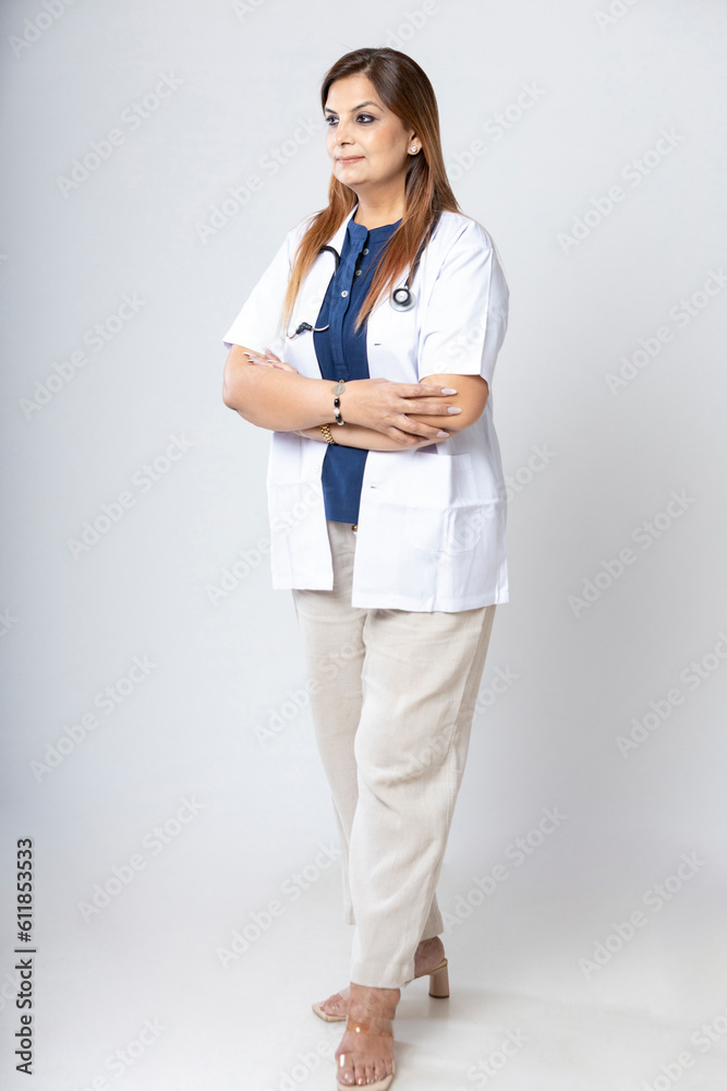 Medical concept, Indian doctor in uniform standing on white background. Medical concept, Indian doctor in uniform standing on white background.